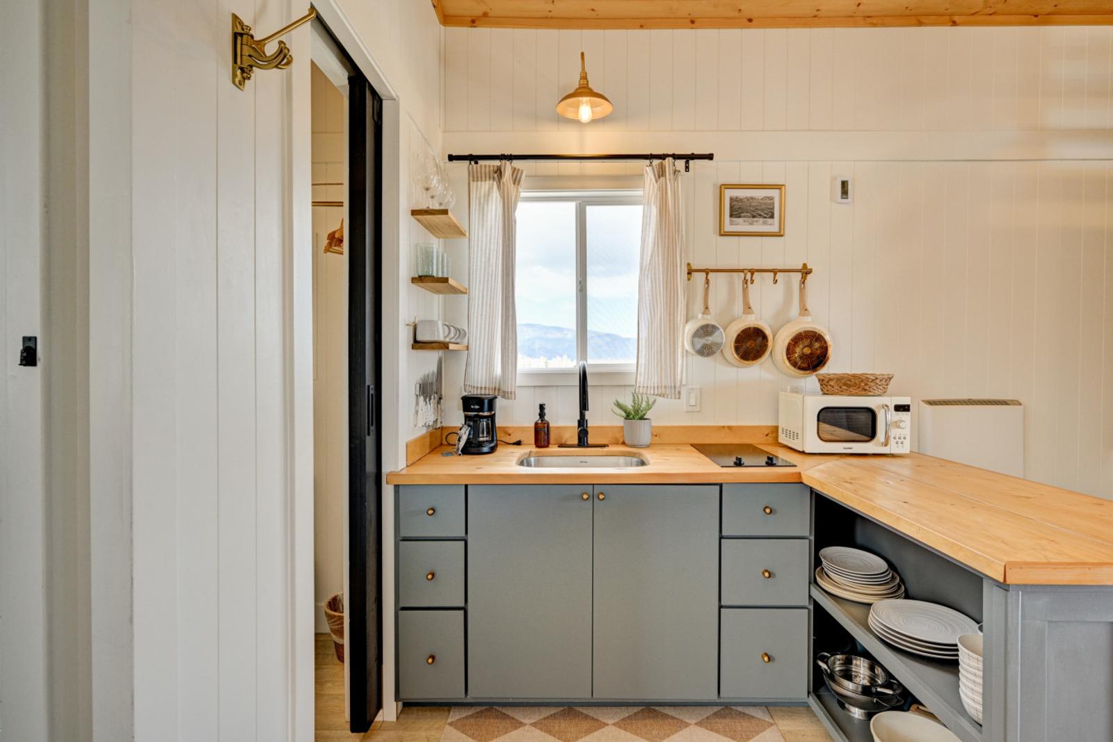 Boutique tiny house kitchen with mountain views — book direct in Buena Vista, CO